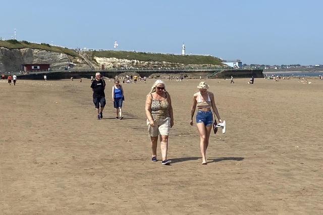 Plenty of people took their daily walk along the sands and took time to catch up with others.