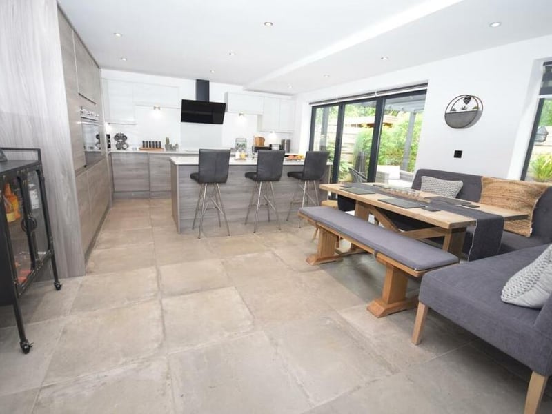 Time now for our first look at the stunning open-plan kitchen/diner, which also includes a living area. It spans the rear of the £600,000 property. In the foreground is a seating area where the family can get together.