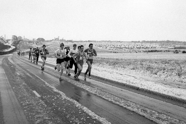 A group of runners brave the cold roads of Mansfield back in 1986.