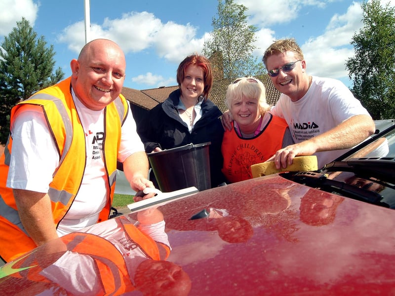 Sponsored car wash at Kirkby Fire Station for Fire Brigade Benevolent Fund and PASIC (Parents Association for Seriously Ill Children) in 2007. With (left to right) Martin Shepherd, secretary of Mansfield & Ashfield Driving Instructors Association, Jessica Buxton whose family is supported by PASIC, Bea Brunton PASIC co-ordinator, Kevin Hooton, chairman of Mansfield & Ashfield Driving Instructors Association.