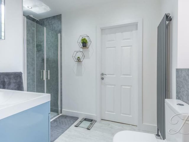 The second en suite on the first floor is a stylish affair, with enclosed shower, low-flush WC and wash hand basin.