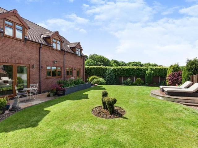 A terrific shot of the attractive and enclosed garden at the rear of the house. There is a paved seating area, a secure fenced boundary and outdoor power and lighting.