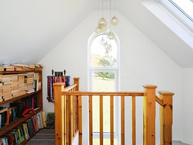 Up to the stairs to the second and third floors at the £400,000-plus property, where the landings expose another feature window at the side of the house.