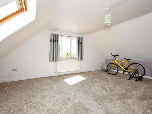 One of the bedrooms is a versatile space that could be converted into multiple uses.