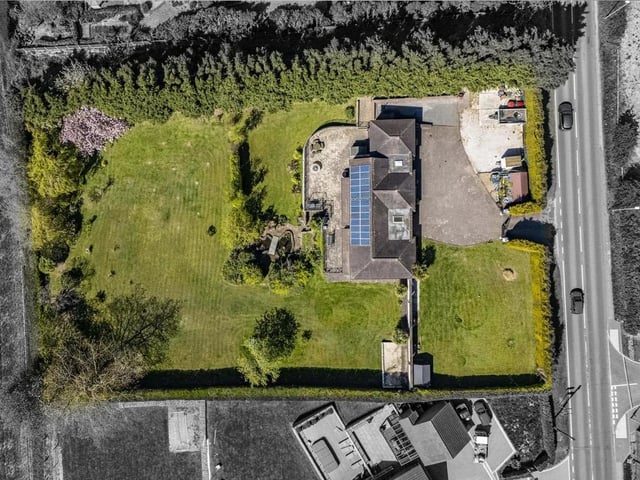 Set within approximately an acre of established grounds, the property enjoys a wonderfully private feel, complemented by open countryside views stretching across fields to the rear