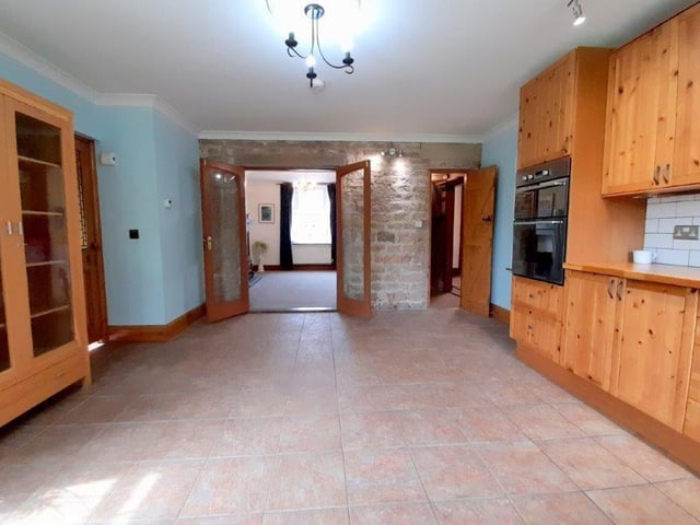 A shot of the breakfast kitchen from a different angle. Appliances and storage space abound.