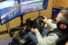 Mark Taylor tackles virtual truck racing. Photo by Paul Horton.