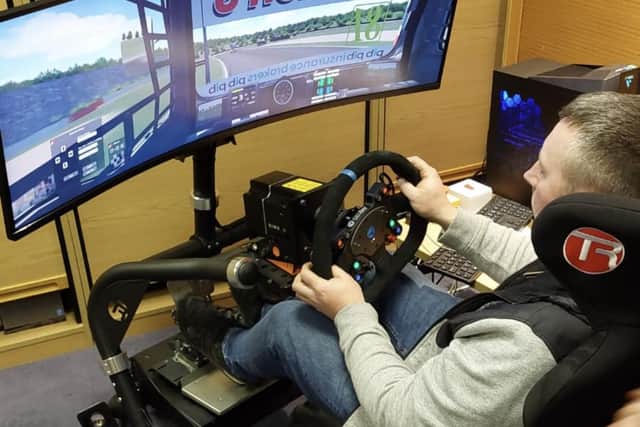Mark Taylor tackles virtual truck racing. Photo by Paul Horton.