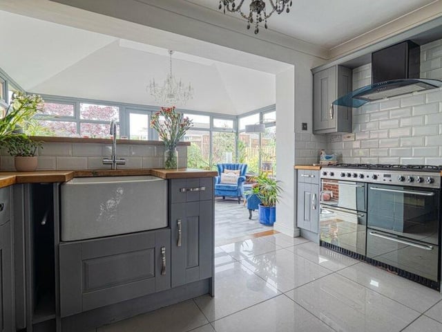 The modern kitchen really is a cook's dream. Other features include a porcelain sink, dishwasher and gas cooker with extractor hood and glass canopy. As you can see in the background of this photo, it also opens out into an entertainment room.