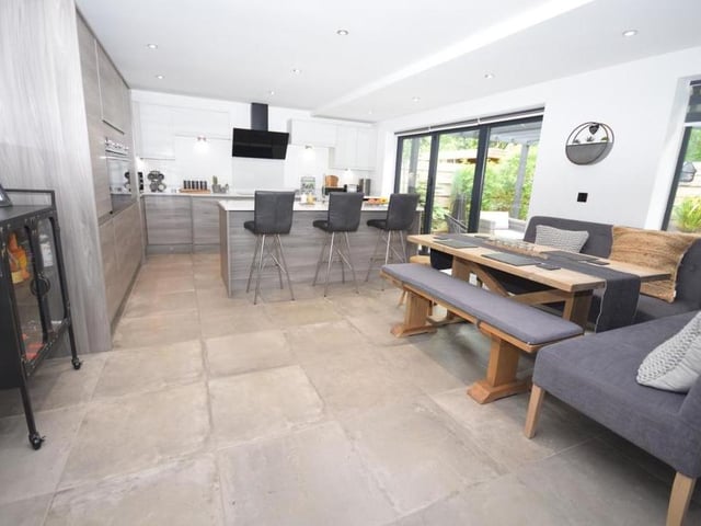 Let's start our tour of the Rockcliffe Grange property as we mean to go on, with the space that dominates the ground floor - the stunning open-plan dining kitchen, with family living area. It spans the width of the house and its comtemporary style cannot fail to impress.