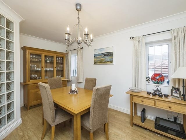 The dining room at the bungalow is a pleasant place for sit-down family meals. It has a laminate floor and two uPVC double-glazed windows to the side of the property.
