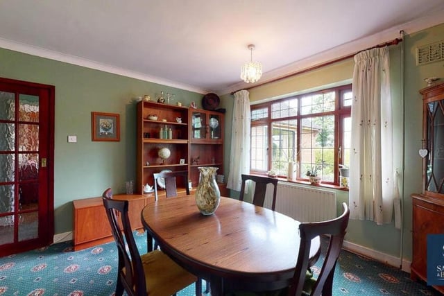 This room is currently being used as a delightful dining room, with fine views from the window of open fields. But it could also be converted into the bungalow's fourth bedroom if necessary.
