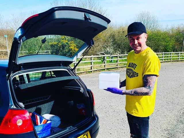 Paul delivering his cheesecakes straight into the boot of a customer's car.