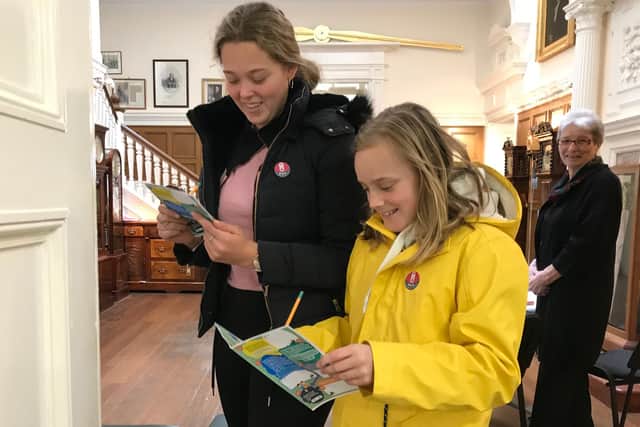 Visitors peruse the artefacts at the museum.