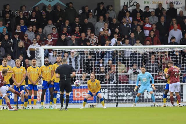 Christy Pym made a number of magnificent saves to help Mansfield Town to victory.