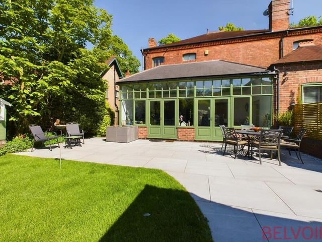 Step outside the French doors from the orangery and straight on to this large, porcelain-tiled patio area, which is a perfect spot for al fresco dining or drinking in the back garden.