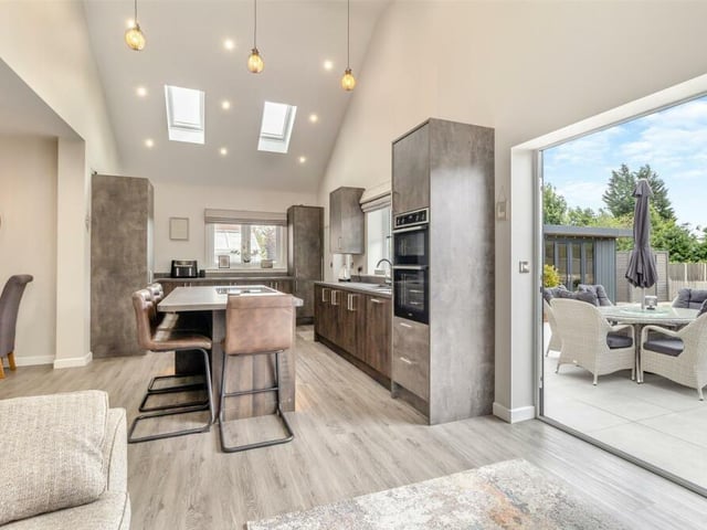 There's only one place to start our tour of the £395,000 Forest Town bungalow -- and that's in the stunning open-plan living/dining kitchen, with a 4.4-metre vaulted ceiling and bi-folding doors leading out to the south-facing rear garden. Ceiling spotlights and four Velux windows add to the brightness.