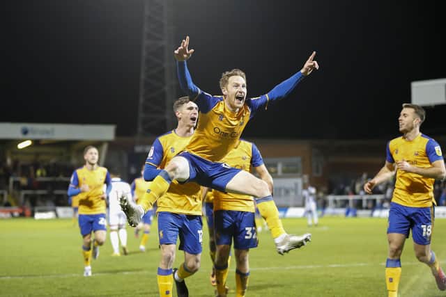 Stephen Quinn celebrates a goal with team mates last season.