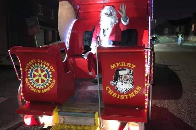 It's Merry Christmas from the Santa's Sleigh tour of Sutton Rotary Club as it prepares to pass through the streets of the town.