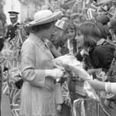 Coun George Jelley, in his role as chairman of the district council, escorts the Queen on her visit to Mansfield in 1977