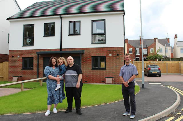Moving-in tenants Jonathan Gilkinson, Rose Morley and their daughter, Iris, outside their new home on Rosemary Avenue, Mansfield, with the town's Mayor, Andy Abrahams.