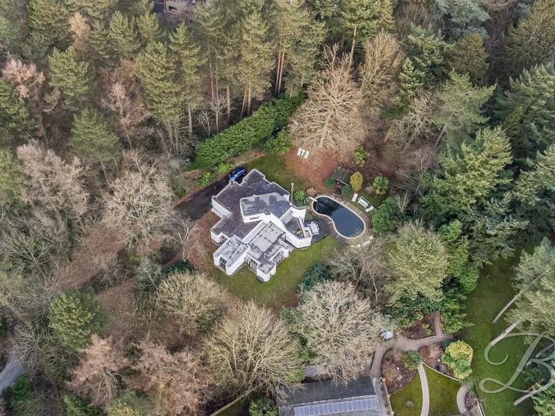 The expansive garden, surrounded by mature woodlands, provides a peaceful setting to enjoy all year round.