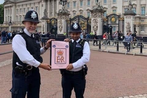 It made it! The book of condolence is pictured outside Buckingham Palace