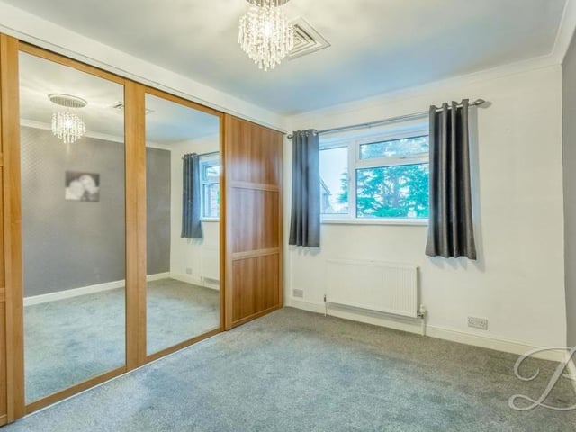 This bedroom benefits from a large and handsome fitted wardrobe.