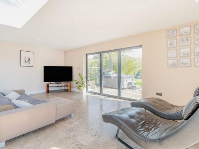 This the relaxing living area in the open-plan kitchen extension at the £690,000 property. Put your feet up after a hard day at work.