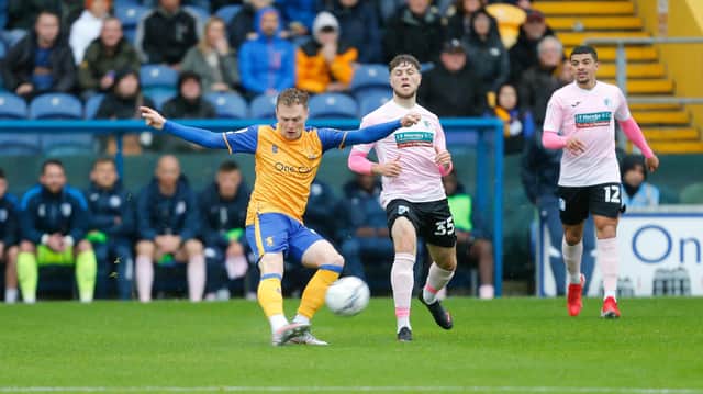 Mansfield Town midfielder George Maris passes the ball forward: Chris Holloway / The Bigger Picture.media