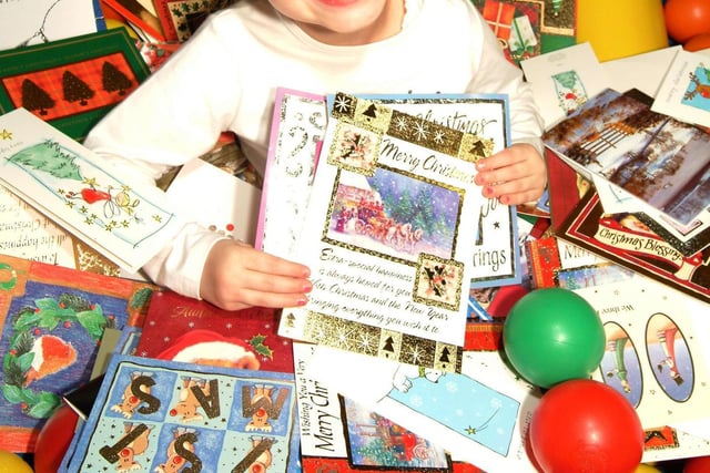 Youngsters at the Wacky Warehouse at the Hobby Horse pub on Derby Road, Chesterfield, recycling old Christmas cards for The Woodland Trust back in 2003, pictured is Caitlin Millican recycling her cards