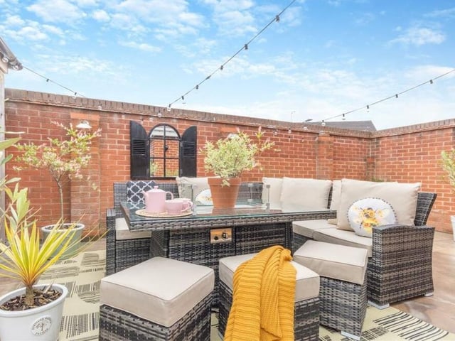 The garden has ample space in which to entertain family and friends, most notably via this luxurious seating area.
