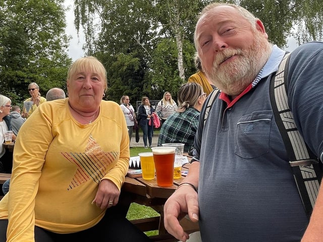 Having a drink and waiting patiently for the cyclists.