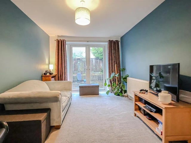One of three reception rooms - perfect for use as a snug or playroom and with double doors leading out to the patio.