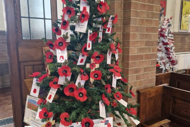 A tree decorated with poppies.