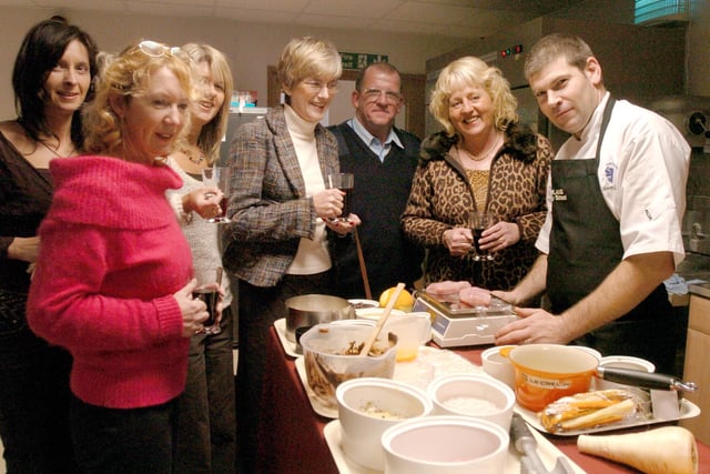 Some of the paying guests to a Christmas Cookery Evening chat to Head Chef Simon Lilley before his demonstration at Coghlans Cookery in 2006