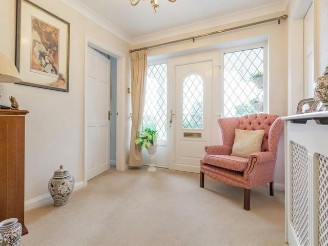 The entrance hallway offers a warm welcome to the Berry Hill bungalow. It has coving to the ceiling, a built-in storage cupboard and access to the loft via a hatch with ladder attached.