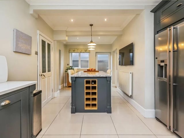 The stylish kitchen is the real heart and hub of the home.