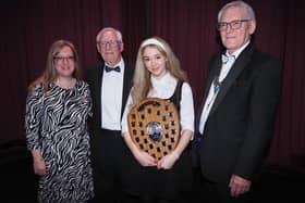 Winning vocalist Mia Rathbone (15) from Razzamatazz, pictured with presenter Jo Davis from BBC Radio Nottingham, organiser Paul Bacon, and Rotary President Kelvin Bowman.