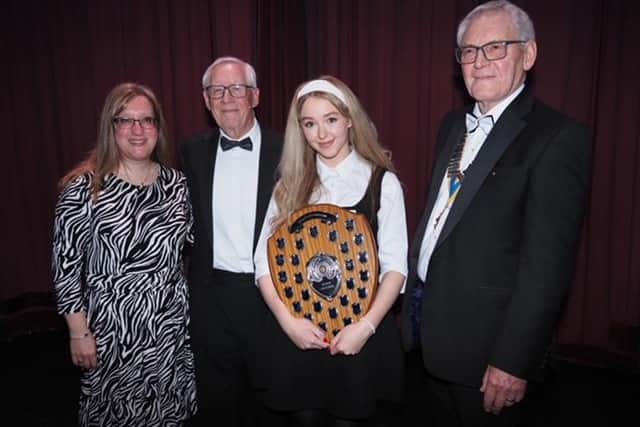 Winning vocalist Mia Rathbone (15) from Razzamatazz, pictured with presenter Jo Davis from BBC Radio Nottingham, organiser Paul Bacon, and Rotary President Kelvin Bowman.