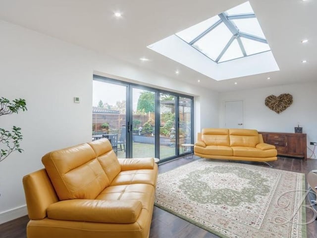 Offering comfort, brightness, via a stunning skylight, and garden views, via large bi-folding doors, the sitting room is the perfect place to unwind after a day at work.