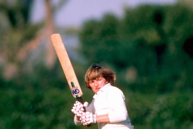 Enid with the bat she has donated