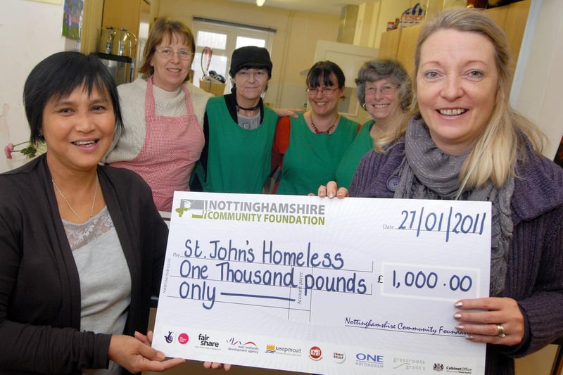 Nina Dauban, right, chief executive of Nottinghamshire Community Foundation, presents Beacon Project manager Carmela South with a £1,000 cheque from their Surviving Winter Appeal, also pictured are volunteers for the St. John's Church centre are  Celia Deberry, Nora Bestwick, Ashley Andrews and Val Starbuck.