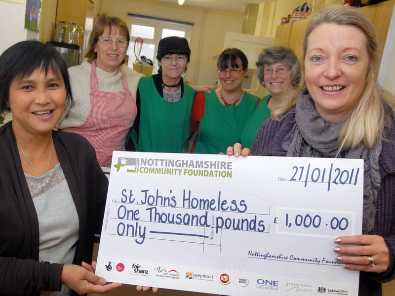 Nina Dauban, right, chief executive of Nottinghamshire Community Foundation, presents Beacon Project manager Carmela South with a £1,000 cheque from their Surviving Winter Appeal, also pictured are volunteers for the St. John's Church centre are  Celia Deberry, Nora Bestwick, Ashley Andrews and Val Starbuck.