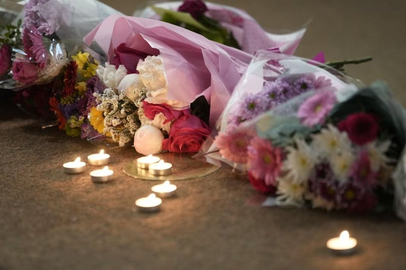 Candles and flowers commemorate the three people, two of whom were students, killed in the Nottingham attacks.