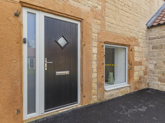 Just knock on the front door and in we go to check out the spacious, beautifully appointed house.