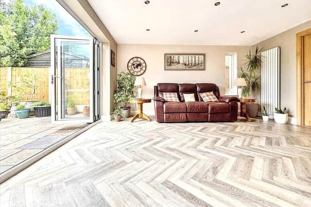 The open plan space is flooded with natural light thanks to the bi-folding doors, opening up to the patio and garden
