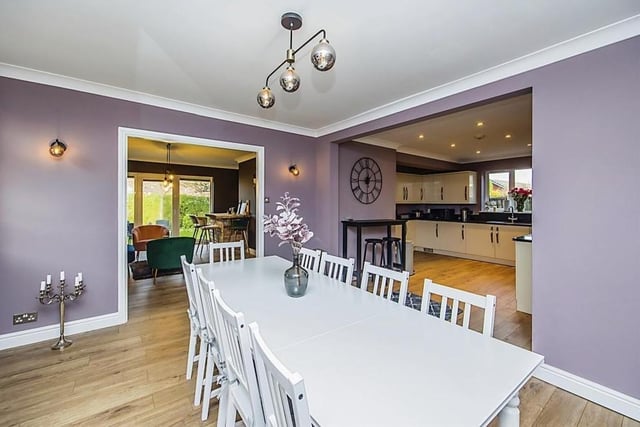 The spacious kitchen at the £525,000-plus house includes this smart dining area. In the background is the bar and to the right is the kitchen.