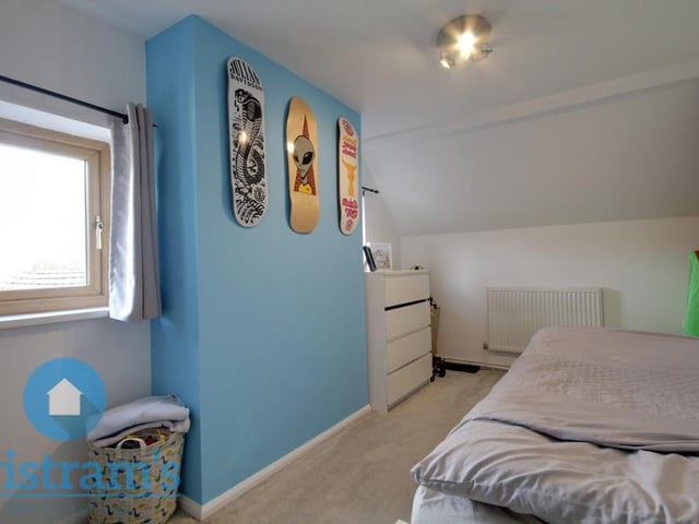 This is bedroom number two at the £295,000 cottage. Again, the floor is carpeted, while two uPVC windows to the side let in a good amount of light .