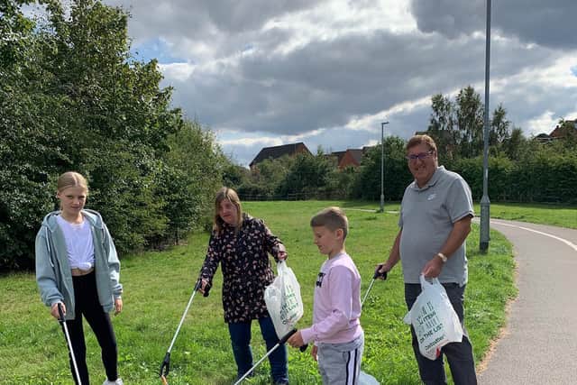 Litter picking in the Quarry, in Mansfield L to R: Amelia Arnold, aged 12, Katie Rickersey, Harry Arnold aged 10 and Rotarian Stewart Rickersey - Mansfield Rotary Club